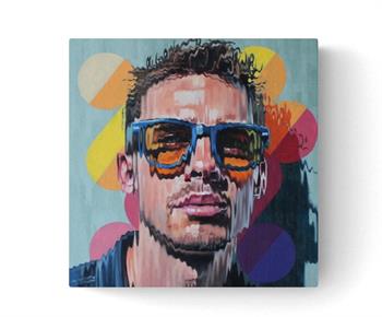 Bold pop art portrait of a young man wearing blue sunglasses