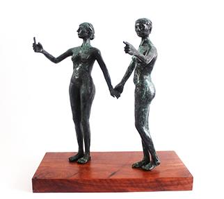 bronze sculpture of two women holding hands taking a selfie
