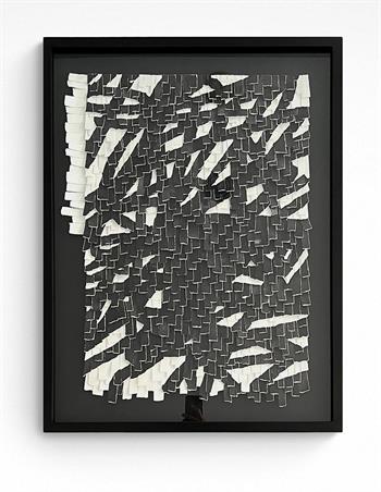 torn paper collage artwork in strips of black and white in black frame