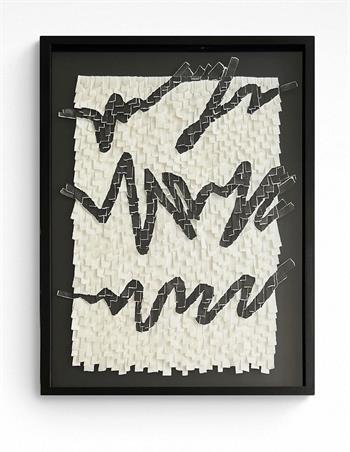 collage of torn strips of paper in black and white in black frame