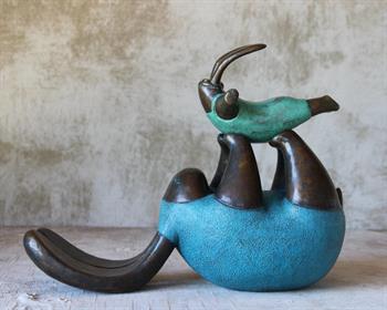 Whimsical bronze sculpture representing a mother a child playing aeroplane