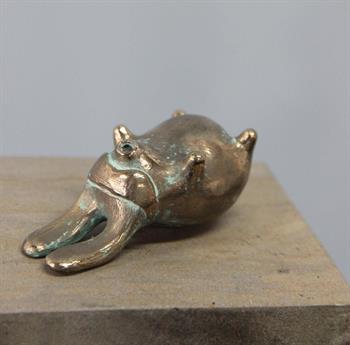 small bronze sculpture of a fantasy rabbit like creature lying on its back