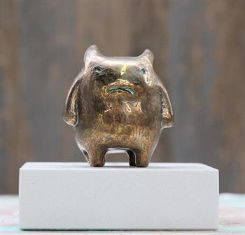 small bronze sculpture of a fierce looking fantasy creature