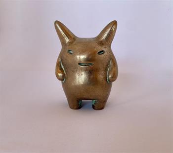 small bronze sculpture of a fierce fantasy creature