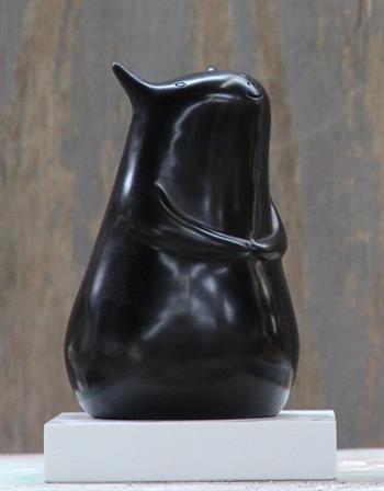 Hello Creature is a naive sculptural black figure with a gentle presence.